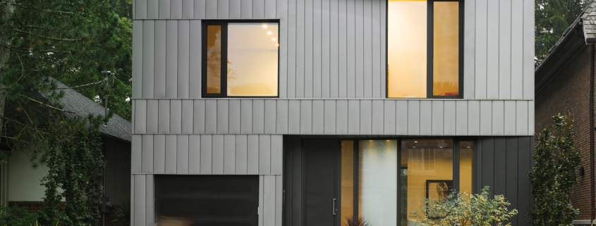 Vertical exterior panels by Praxy Cladding are made of zinc and are insulated to enhance energy retention.